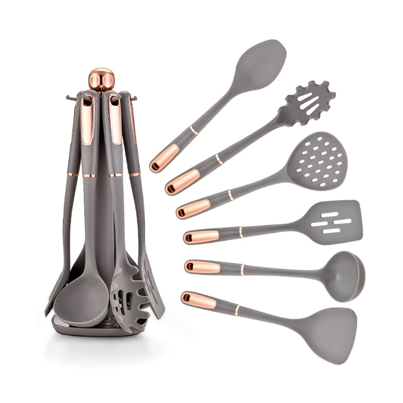 Che cos'è un kit di utensili da cucina in silicone per principianti con manico in PP?